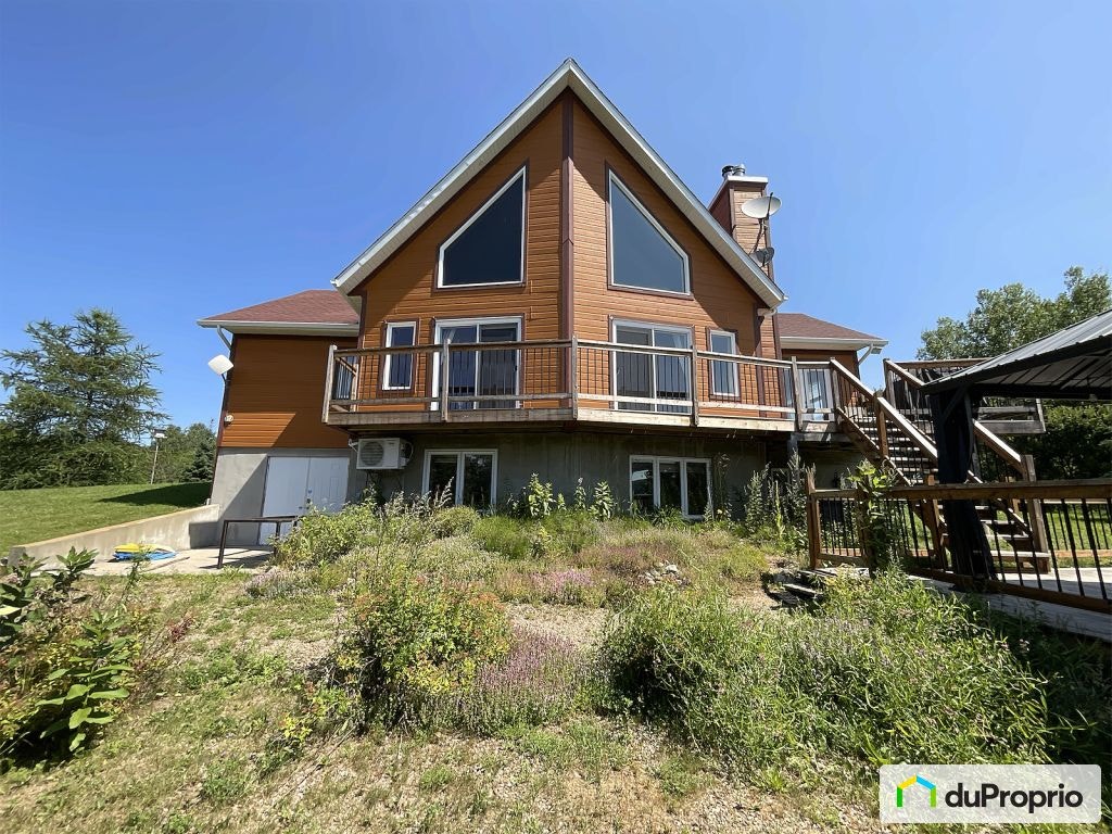 $749,999 - Price Taxes Not Included - Cottage in Mandeville — photo 2