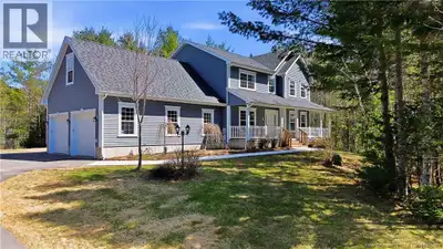Sitting on 2.15 acres, surrounded by mature trees and positioned on a quiet court in Hanwell NB, thi...