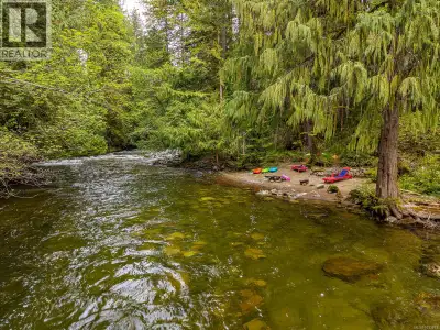 Set on 1.70 acres along the Browns River, this rare riverfront property offers a unique blend of nat...