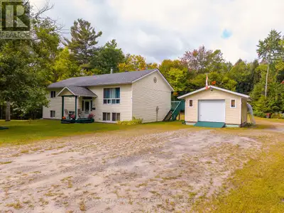 This spacious three-bedroom home sits on a flat, tree-filled 1.4-acre lot just 10 minutes from Parry...