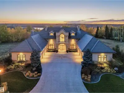 Windermere Ridge Estates, an extraordinary custom Cove Properties home nestled along the edge of the...