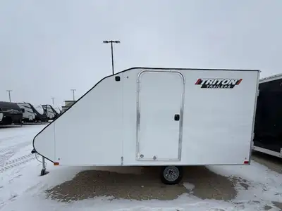 Triton 8x12 snowmobile trailer. Rear ramp door, side access door, and front access door.White in col...