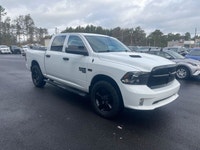 The 2022 Ram 1500 Classic Express, presented in a pristine white finish, is equipped with a robust 4... (image 3)
