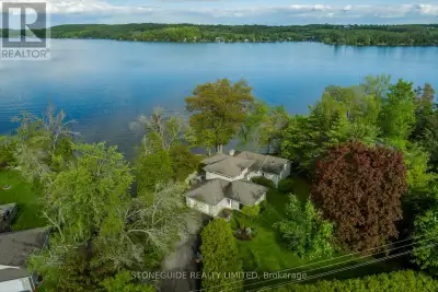 This spectacular lakeside home on Chemong Lake offers over 160 feet of frontage (not including the c...