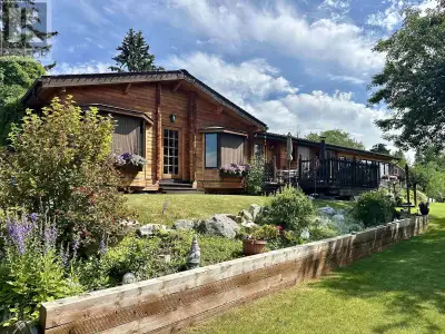Pan abode western red cedar home on 1.2 acres with a view of the Nechako River located close to the...