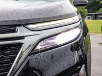 Experience the dynamic drive of the 2022 Chevrolet Equinox AWD RS in a striking black shade with adv... (image 6)