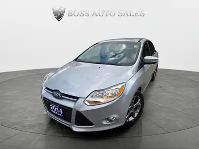 The 2014 Ford Focus SE, presented in a striking silver finish, offers a front-wheel-drive setup that...