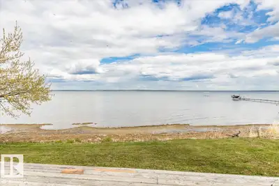 LAKEFRONT lot at Grandview! The lot is partially fenced with a gate at the back and storage shed. Ca...