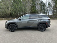 This Hyundai Tucson has a strong Gas 4cyl 2.5 L engine powering this Automatic transmission. Black L... (image 9)