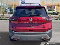 Experience enhanced visibility and an open-air feel in this stunning red 2021 Nissan Rogue SV, featu... (image 3)