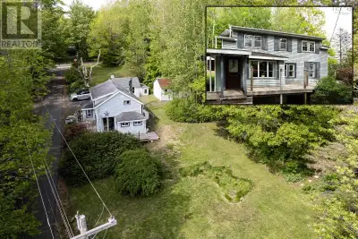 Single-family home set atop a gentle hill in the village of Bear River, often called the Switzerland...