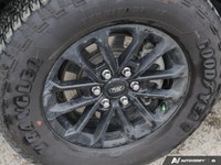 * Leather-trimmed heated and ventilated front bucket seats with a 10-way power driver's seat * 12-in... (image 8)