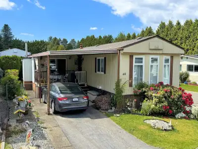 OWN YOUR LAND! Nice corner lot in this 48 lot gated STRATA 55+ retirement park with a strata fee jus...