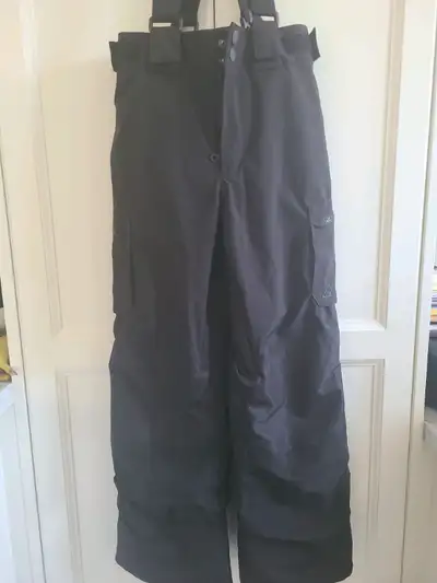 Like new. Worn only a few times last winter. Waterproof, with suspenders and waist velcro adjusters....
