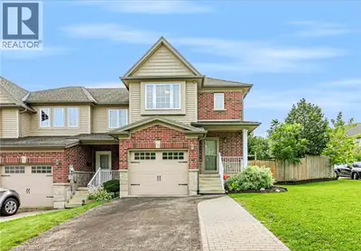 Welcome to 420 Sales Drive, Woodstock a beautifully refreshed end unit freehold townhouse offering e...