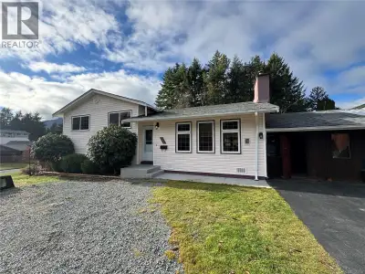 Inviting and tastefully updated, this split-level home offers comfort and versatility on a sunny .17...