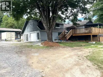 Just shy of 1 Acre, this 3000+ SqFt Rancher style home has tons of character, with it's country kitc...