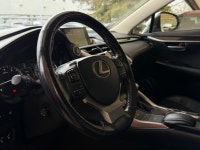 The NX 200t is characterized by its aggressive "spindle" grille and sharp, angular body lines. As th... (image 4)