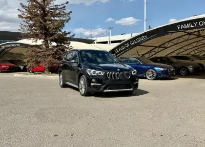 The 2018 X1 xDrive28i serves as a versatile "Sports Activity Vehicle" SAV tailored for urban environ...