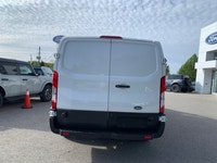 Focused on utility and economy, this Ford Transit is a strong contender in the work van market. This... (image 5)