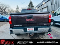 The 2016 GMC Sierra 2500HD 4WD Crew Cab 153.7in. SLT is a heavy-duty pickup truck with a standard 6.... (image 4)