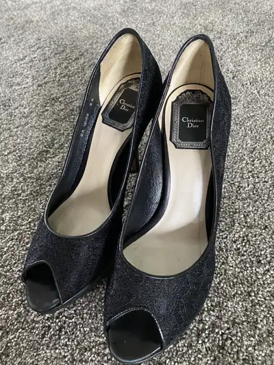 Classic peep toe style. With sole protectors added. Mint condition. Retails for $1000