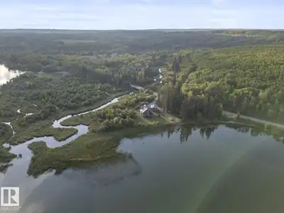 Lakefront Living on Ethel Lake! This custom 1.8-acre waterfront property offers privacy, stunning vi...