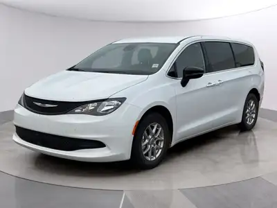 Presenting the 2025 Chrysler Grand Caravan SXT, a pristine white van boasting a sophisticated front-...