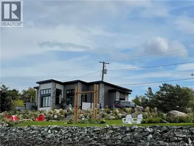Waterfront living at its finest! Newly built modern home on a dbl lot along the Richibucto River off...