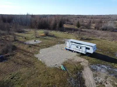 R03//Molson/11.25 acres in Molson, MB RM of Reynolds! This beautiful, treed property backs onto Crow...