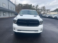 The 2022 Ram 1500 Classic Express, presented in a pristine white finish, is equipped with a robust 4... (image 2)