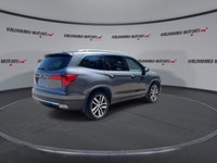 This used 2018 Honda Pilot Touring AWD is a roomy, family-ready SUV with smart features and proven V... (image 7)