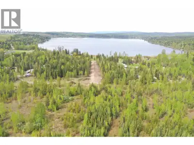 Set on a breathtaking 21-acre parcel directly across from Ten Mile Lake, this exceptional property o...