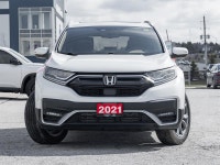 Discover premium comfort and all-weather confidence with the 2021 Honda CR-V Touring AWD. Finished i... (image 1)