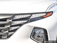 The 2023 Hyundai Tucson Preferred, featuring a brilliant Crystal White exterior complemented by a re... (image 5)