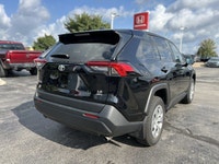 Command the road in this sleek 2023 Toyota RAV4 LE, boasting a Midnight Black Metallic exterior that... (image 4)