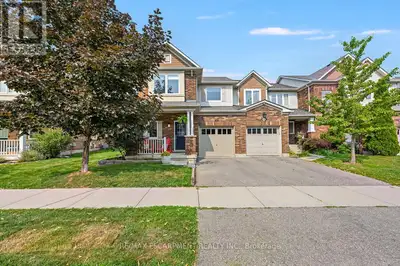 Beautifully finished from top to bottom, this highly desirable Hillsview end-unit townhome is loaded...