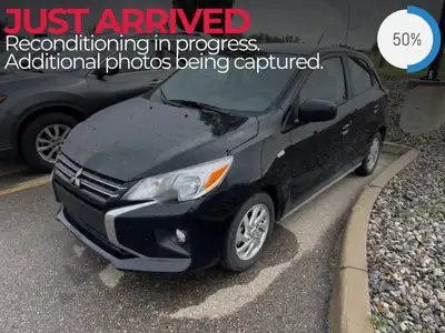 Unveiling the 2024 Mitsubishi Mirage ES CVT, a stylish hatchback in a striking black finish that is...