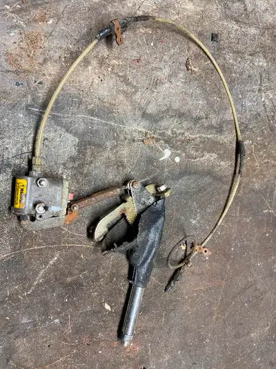 Hand brake lever with mechanism. Make, model and year unknown. If this item is posted it is still av...