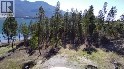 Discover a rare opportunity to own a premier lakefront building lot in the sought-after Springwater...