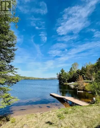 Escape to the tranquil shores of Bearhead Lake with this charming, turn-key fully furnished retreat....