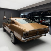 Check out this 1967 Ford Mustang Fastback. This is a gorgeous car. The gold paint is incredible and... (image 2)