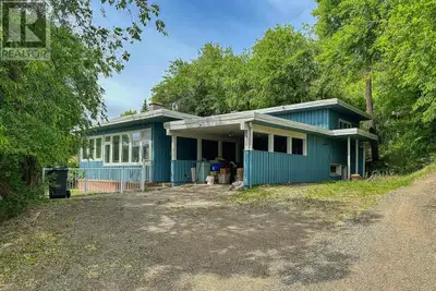 Vintage Charm on a Private .58 Acre Lot! Step into character with this nicely maintained 3-level spl...