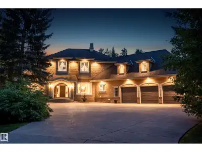 This timeless family residence radiates warmth & quality craftsmanship. Set on 2 private acres in a...