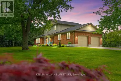 Escape to your own private country retreat on nearly 23 acres of serene landscape, offering unmatche...