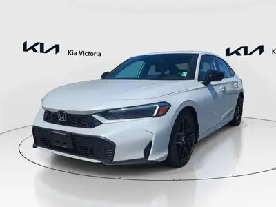 Experience the 2025 Honda Civic Sedan Hybrid Sport in an elegant white finish, with its sporty front...