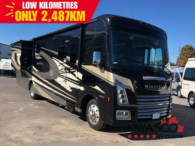 Ex-Rental Winnebago Adventurer Class A gas motorhome 35F highlights: Full and Half Bath Extendable S...