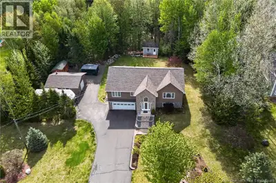 This stunning, custom-built split-entry home offers the perfect blend of comfort, style, and privacy...