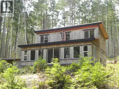 Escape to your own serene retreat with this 1 1/2 story, 1221 sqft cabin nestled on 10 acres in the...