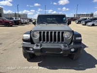 This Jeep Wrangler delivers a Gas/Electric V-6 3.6 L/220 engine powering this Automatic transmission... (image 1)